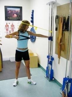 Woman doing physical therapy arm exercises.